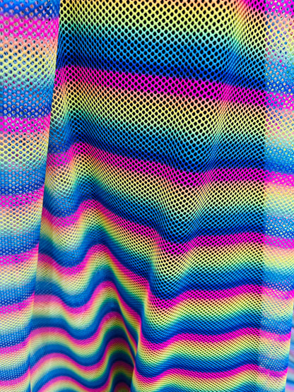 New Rainbow design print on fishnet 2-way stretch 58/60” Sold by the YD.