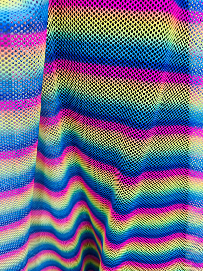 New Rainbow design print on fishnet 2-way stretch 58/60” Sold by the YD.