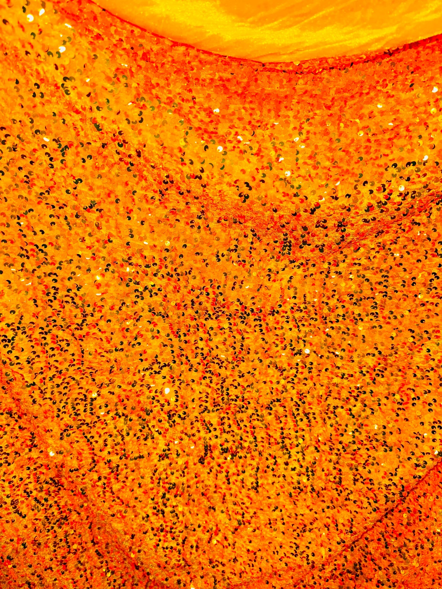 Luxury Iridescent sequins neon orange embroidered on stretch velvet 4-way stretch 58/60” Sold by the YD.