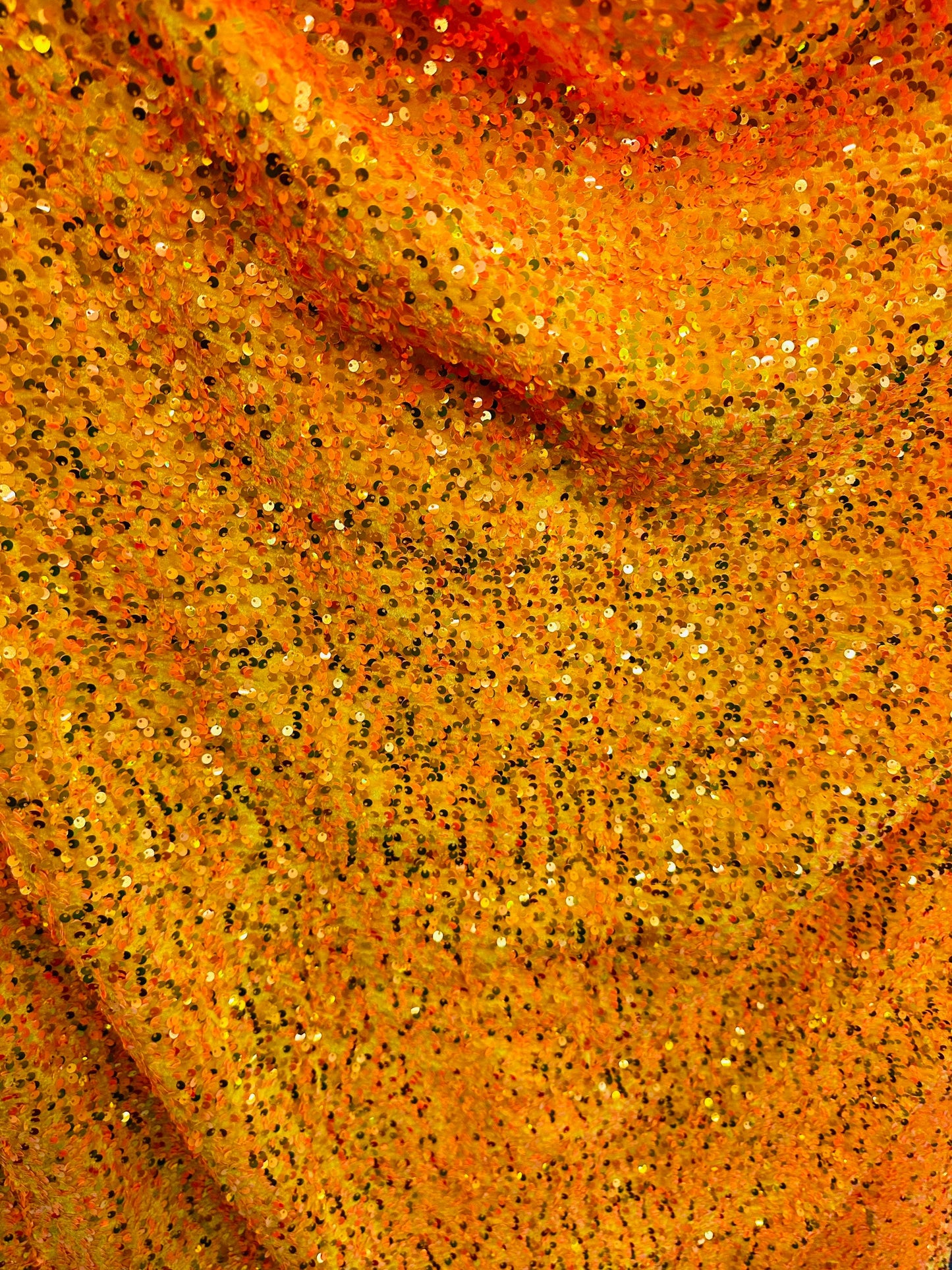 Luxury Iridescent sequins neon orange embroidered on stretch velvet 4-way stretch 58/60” Sold by the YD.