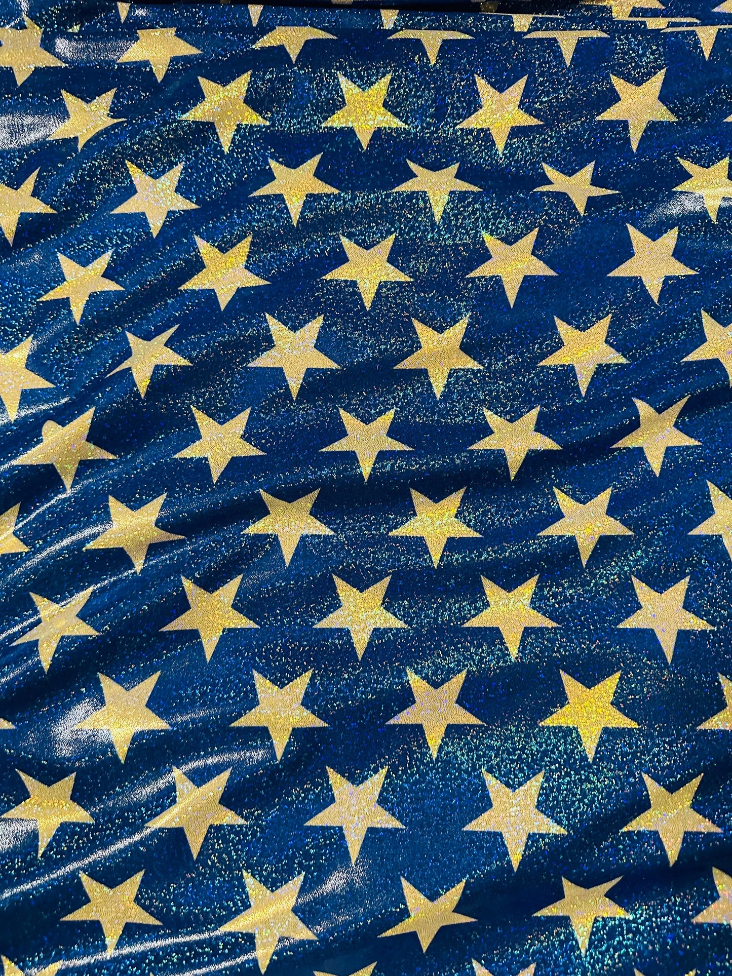 Stars freedom design hologram metallic nylon spandex 4-way stretch 58/60” Sold by the YD. Ships worldwide from Los Angeles California USA