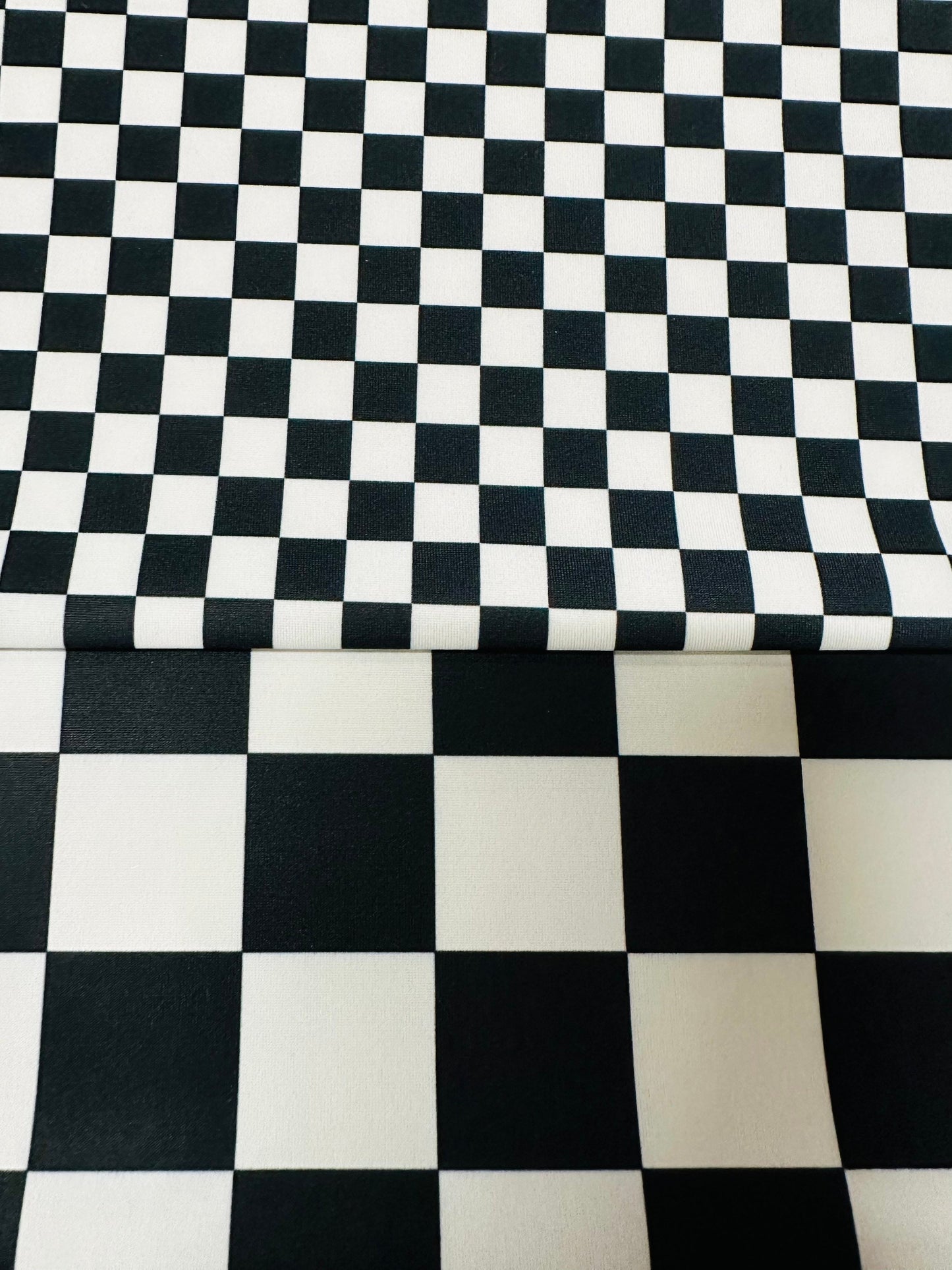 Luxury checkers design 2 sizes print on best quality of nylon spandex 4-way stretch 58/60” Sold by the YD.