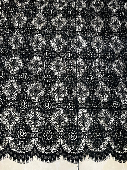 French chantilly lace, Black 36” wide, allover rose abstract design, 2 scallop edges with eyelash fringe. This is an elegant-looking lace.
