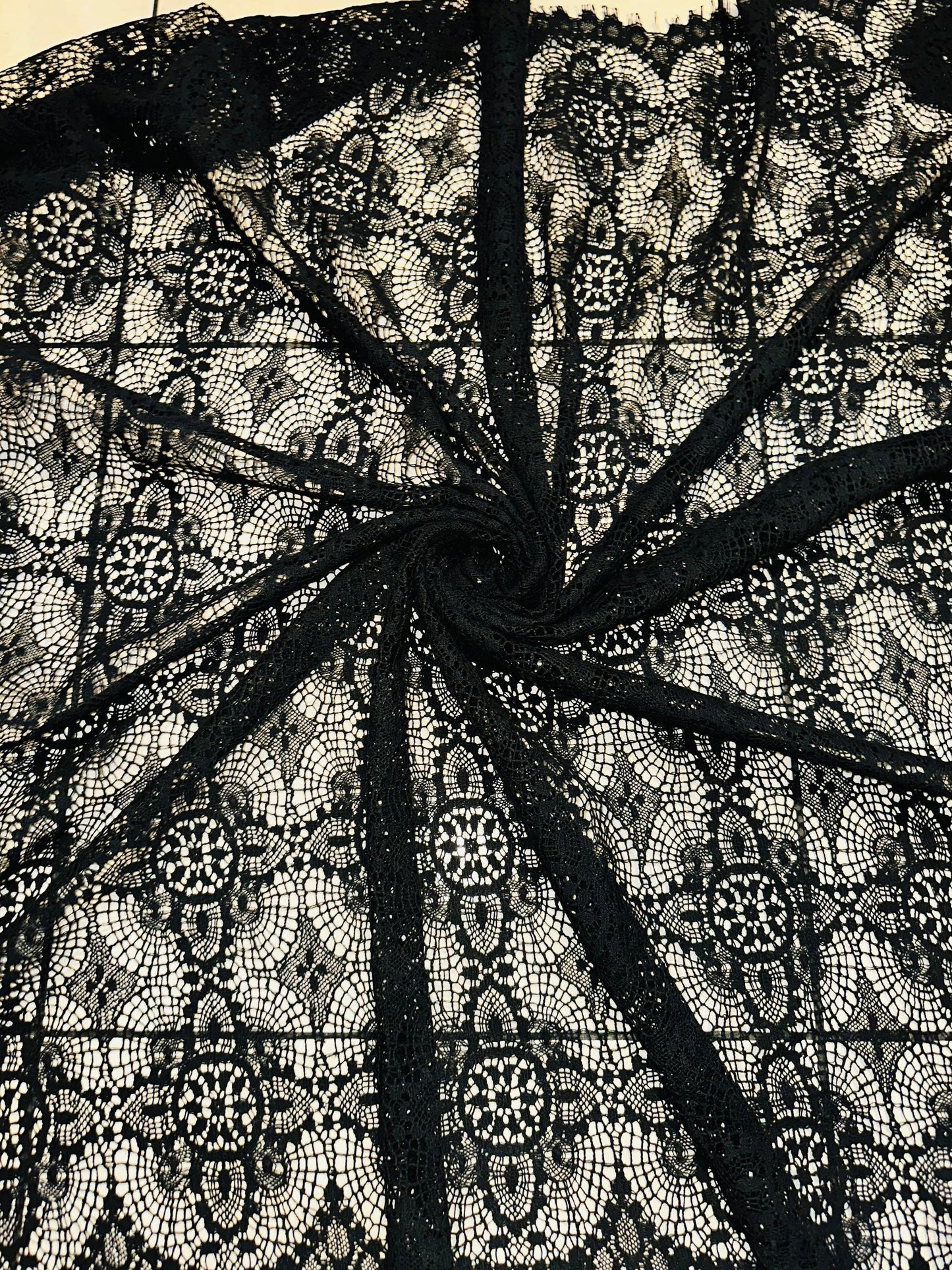 French chantilly lace, Black 36” wide, allover rose abstract design, 2 scallop edges with eyelash fringe. This is an elegant-looking lace.