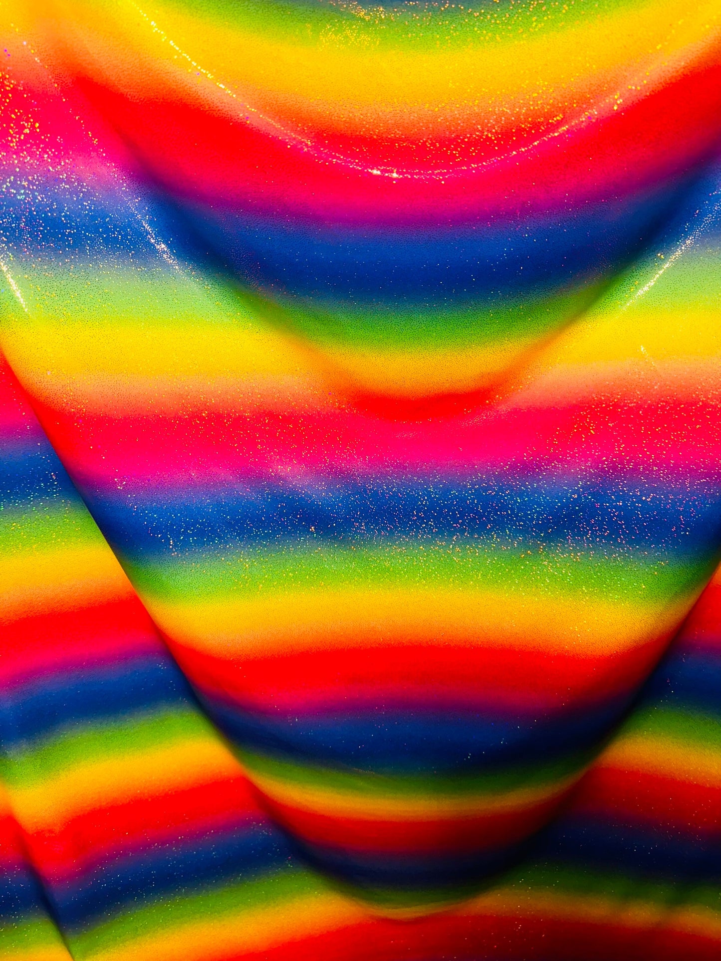 Rainbow design hologram metallic nylon spandex 4-way stretch 58/60” Sold by the YD. Ships worldwide from Los Angeles California USA