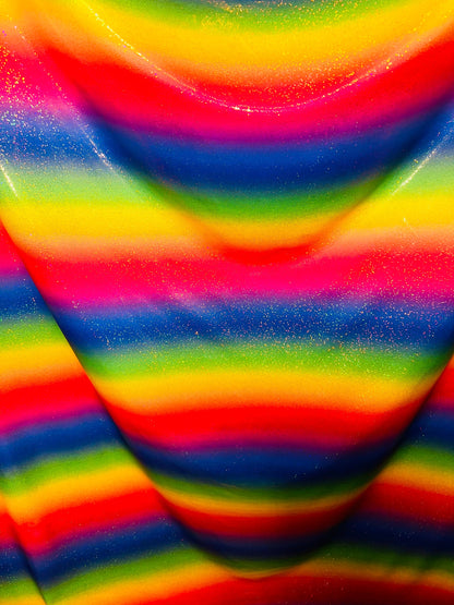 Rainbow design hologram metallic nylon spandex 4-way stretch 58/60” Sold by the YD. Ships worldwide from Los Angeles California USA