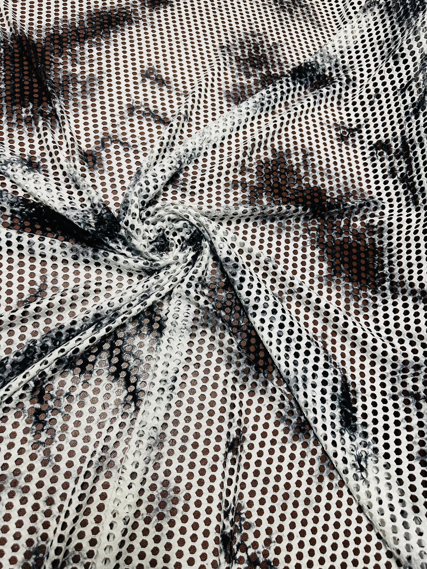 New Tye Dye fishnet white/black  nylon spandex 4-way stretch 58/60” Sold by the YD.