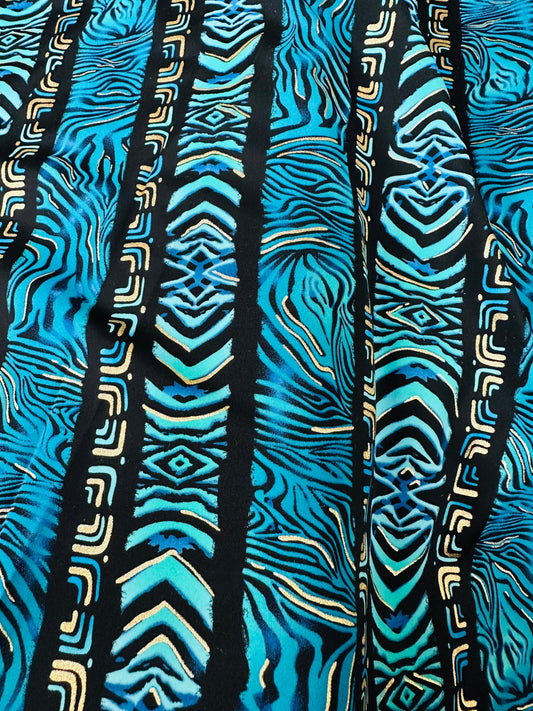 Exotic zebra design on best quality of nylon spandex with gold foil 4-way stretch 58/60” Sold by the YD.