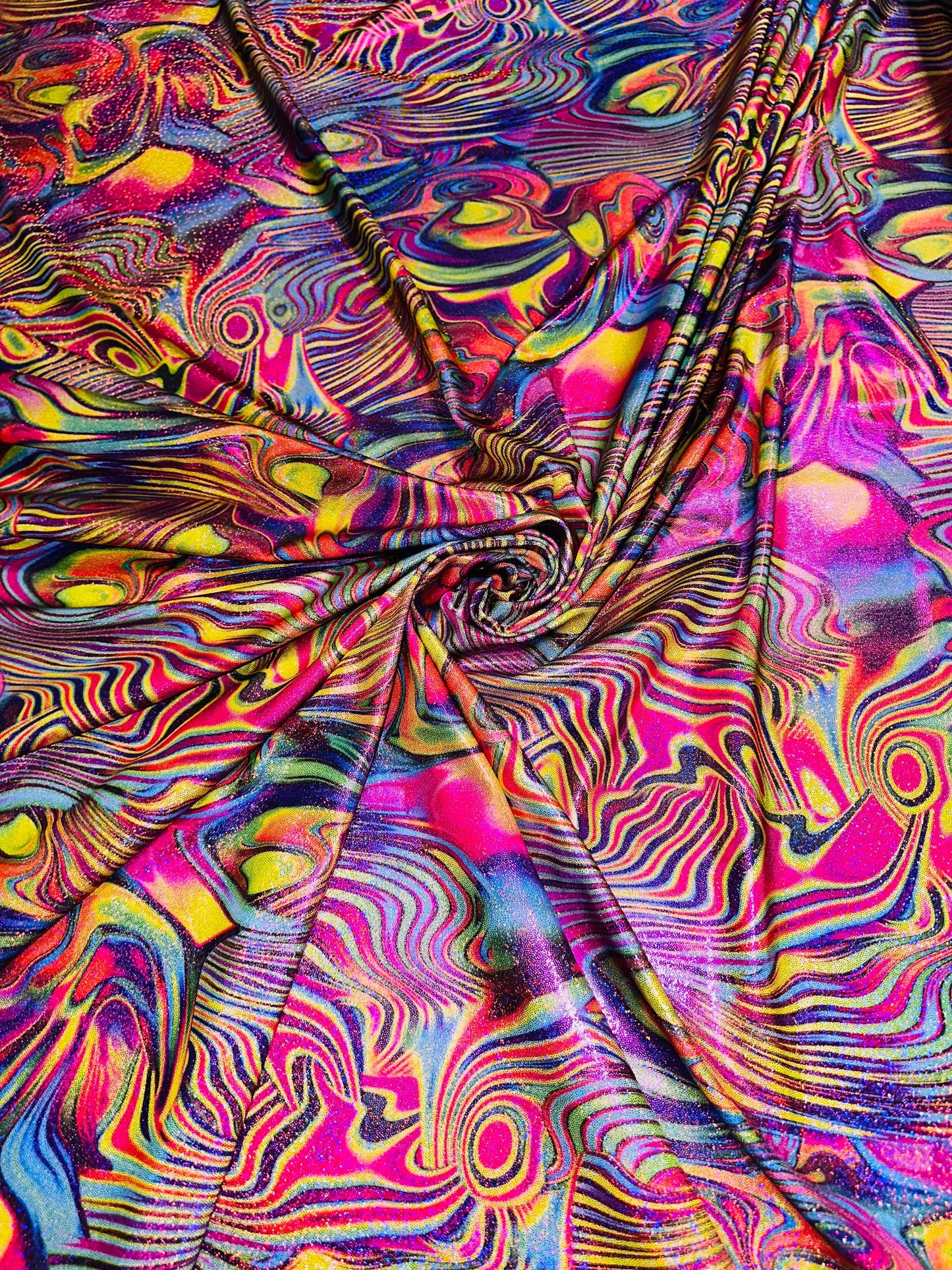 Metallic hologram swirl abstract design print on best quality of nylon spandex 4-way stretch 58/60” Sold by the YD.