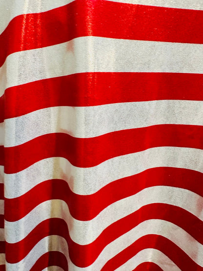 Freedom stripes design red/silver print on metallic nylon spandex with foggy foil 4-way stretch 58/60” Sold by the YD.