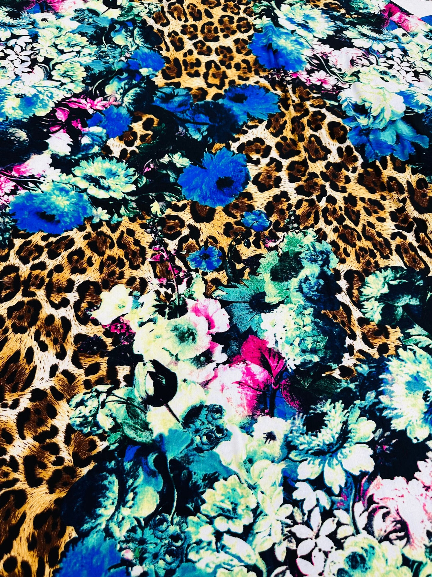 New Leopard design with flowers multicolor print on great quality of poly spandex 2-way stretch 58/60” Sold by the YD.