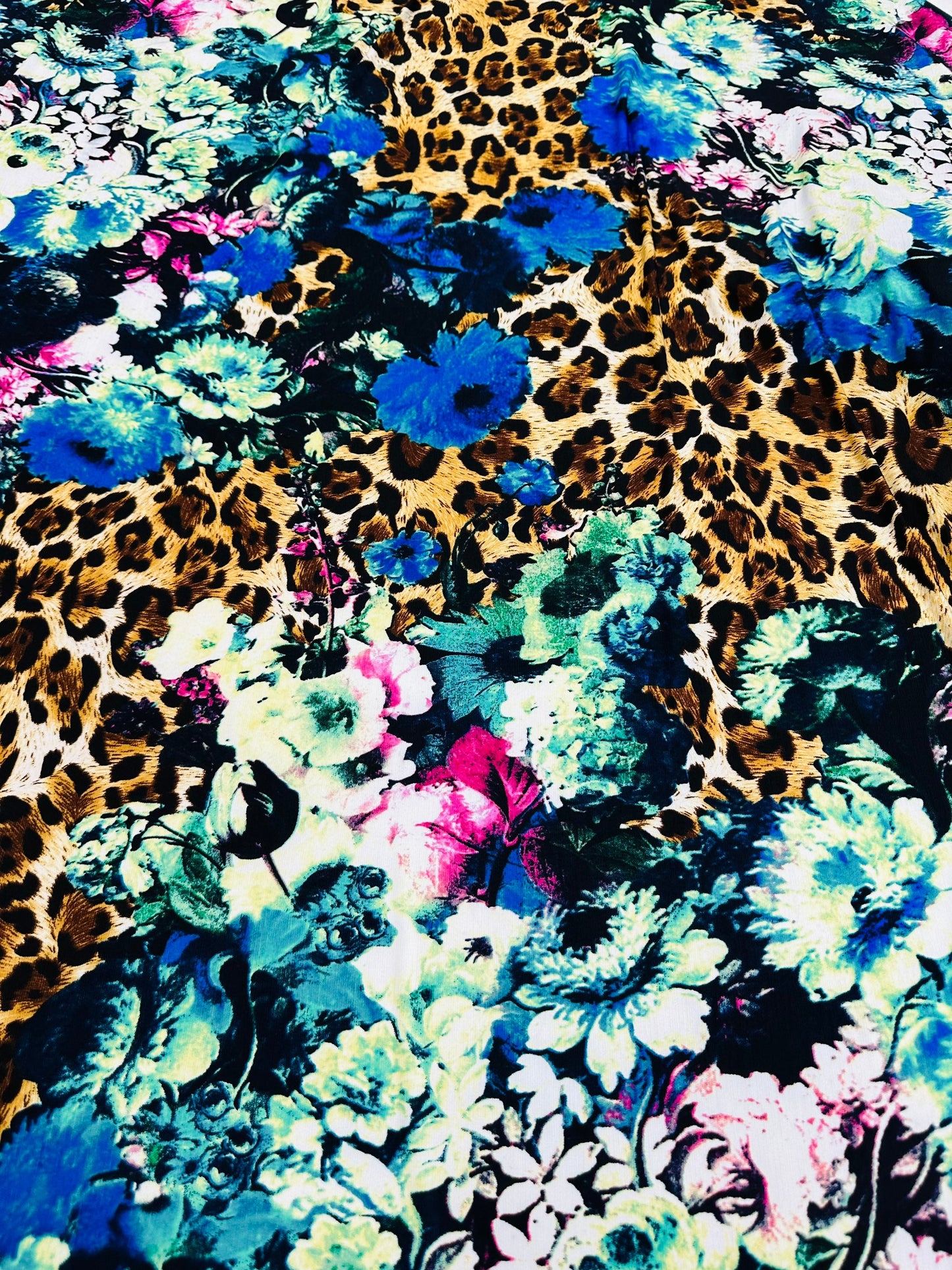 New Leopard design with flowers multicolor print on great quality of poly spandex 2-way stretch 58/60” Sold by the YD.