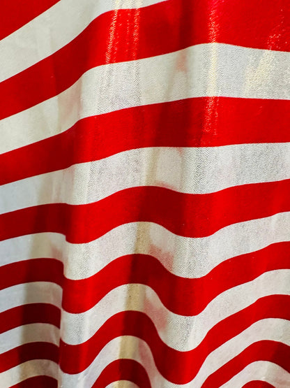 Freedom stripes design red/silver print on metallic nylon spandex with foggy foil 4-way stretch 58/60” Sold by the YD.