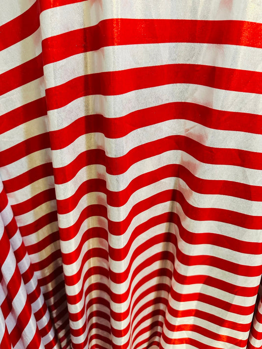 Freedom stripes design red/silver print on metallic nylon spandex with foggy foil 4-way stretch 58/60” Sold by the YD.