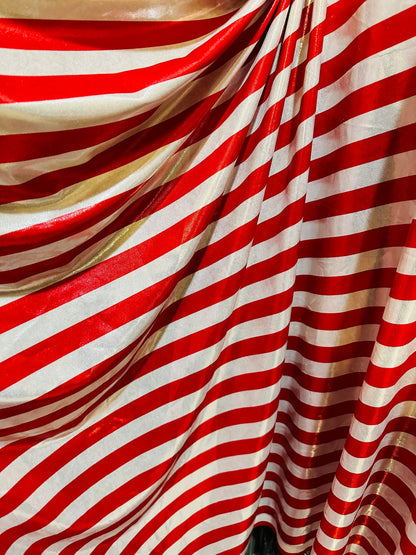 Freedom stripes design red/silver print on metallic nylon spandex with foggy foil 4-way stretch 58/60” Sold by the YD.