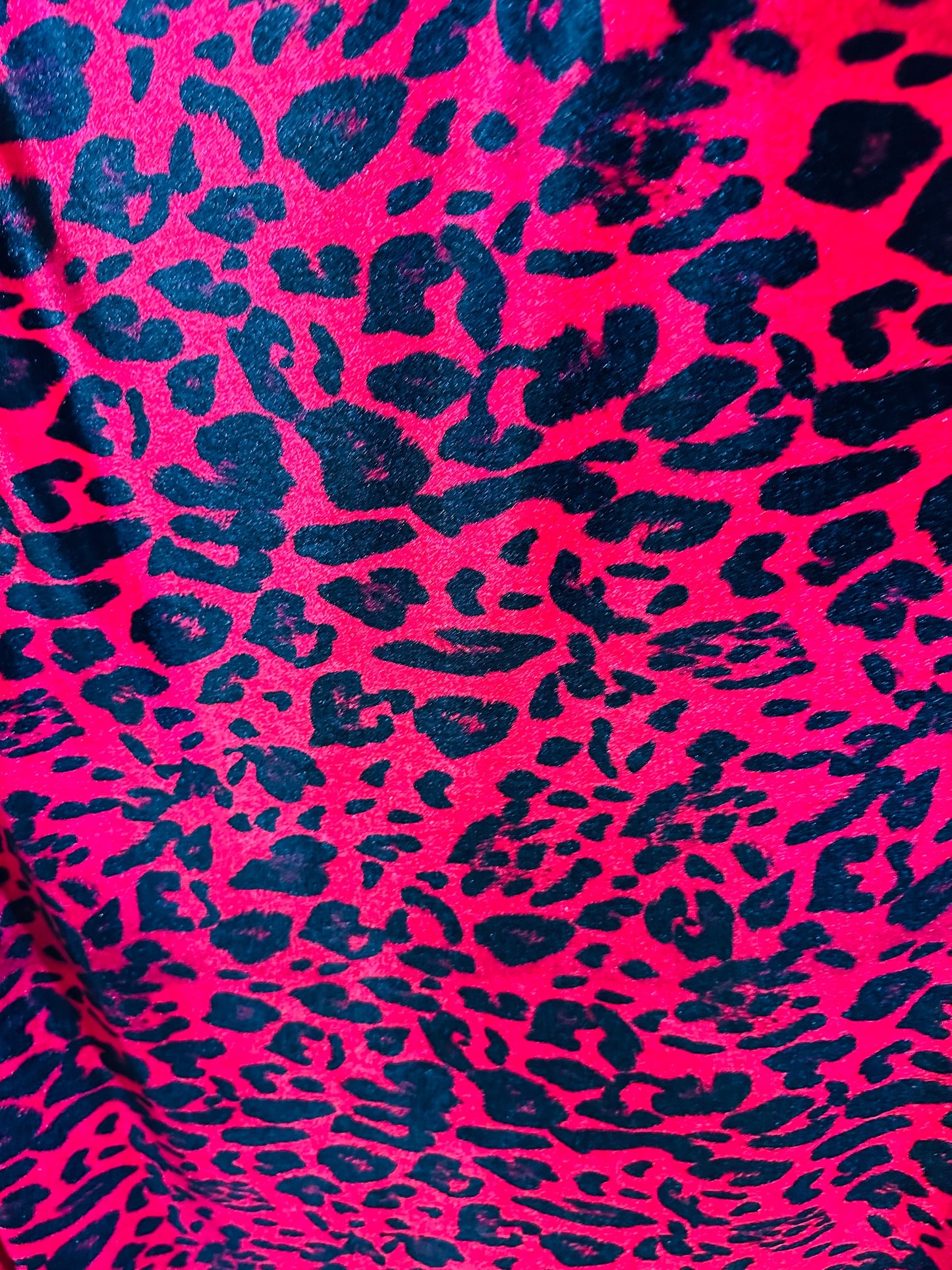 Wild leopard design red/black print on great quality of stretch velvet 4-way stretch 58/60”