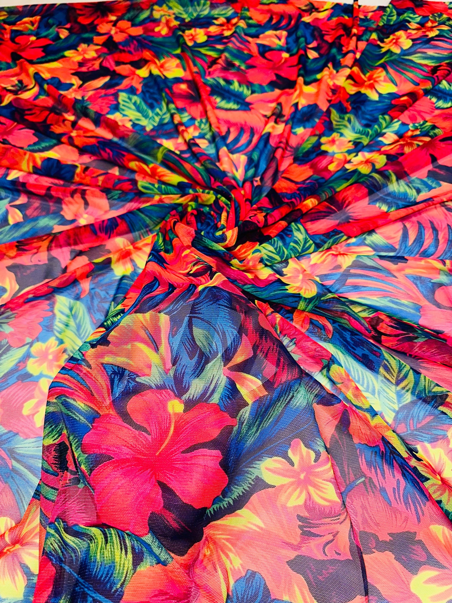 Luxury Hawaiian design with neon colors print on great quality of nylon power mesh 4-way stretch 58/60” Sold by the YD.