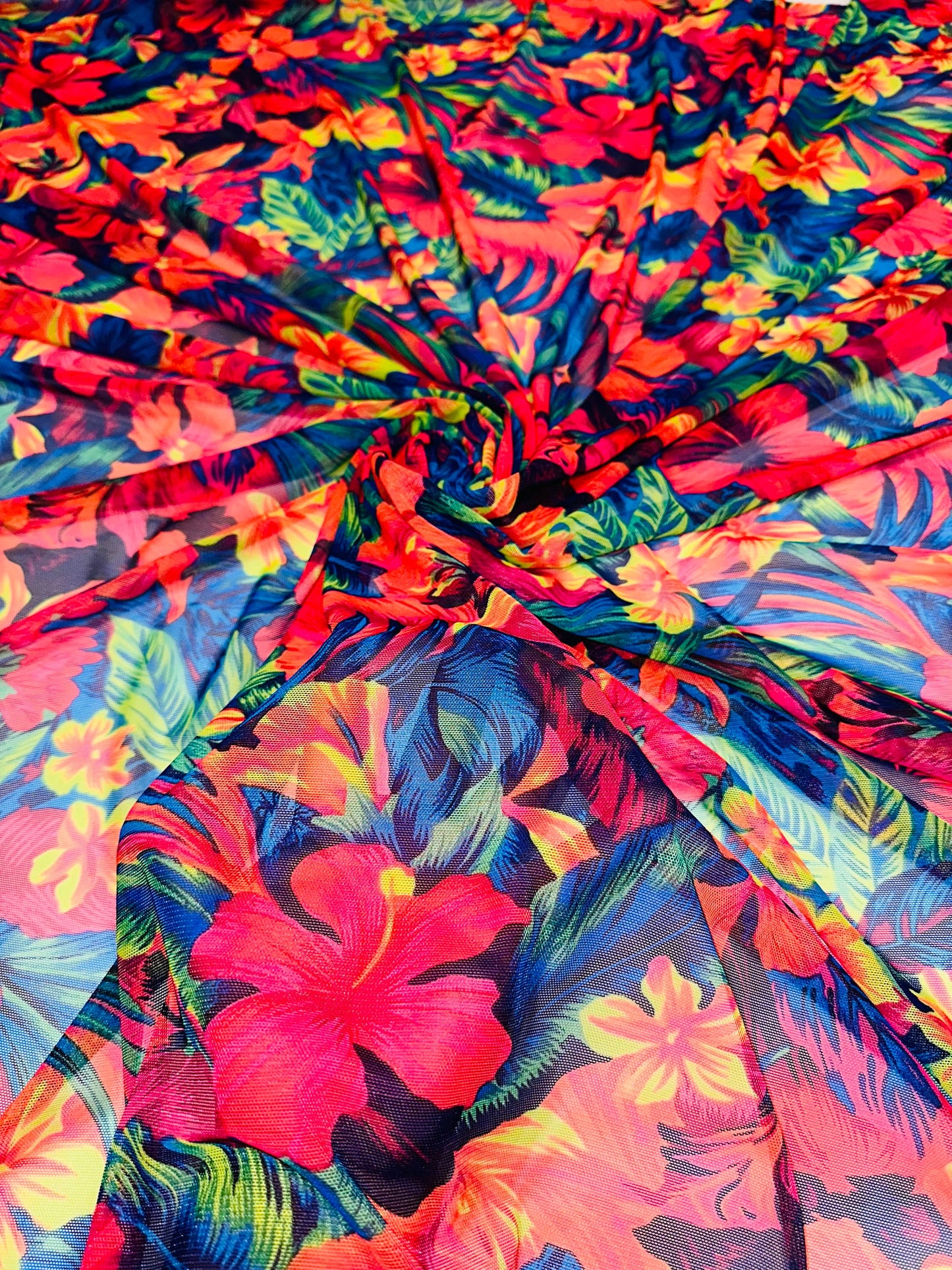 Luxury Hawaiian design with neon colors print on great quality of nylon power mesh 4-way stretch 58/60” Sold by the YD.