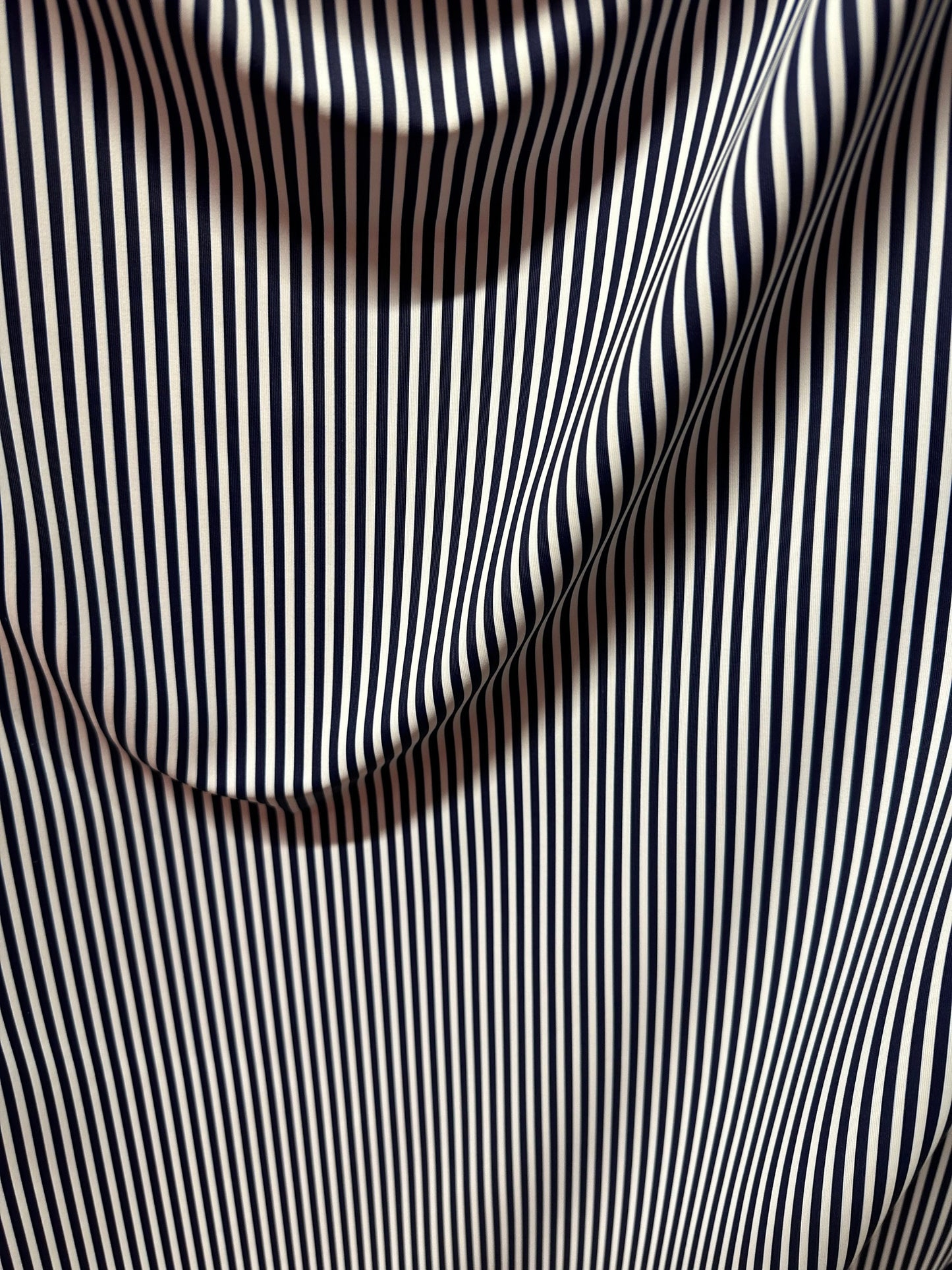 Small striped print nylon spandex best quality white/navy 4-way stretch 58/60” Sold by the YD.