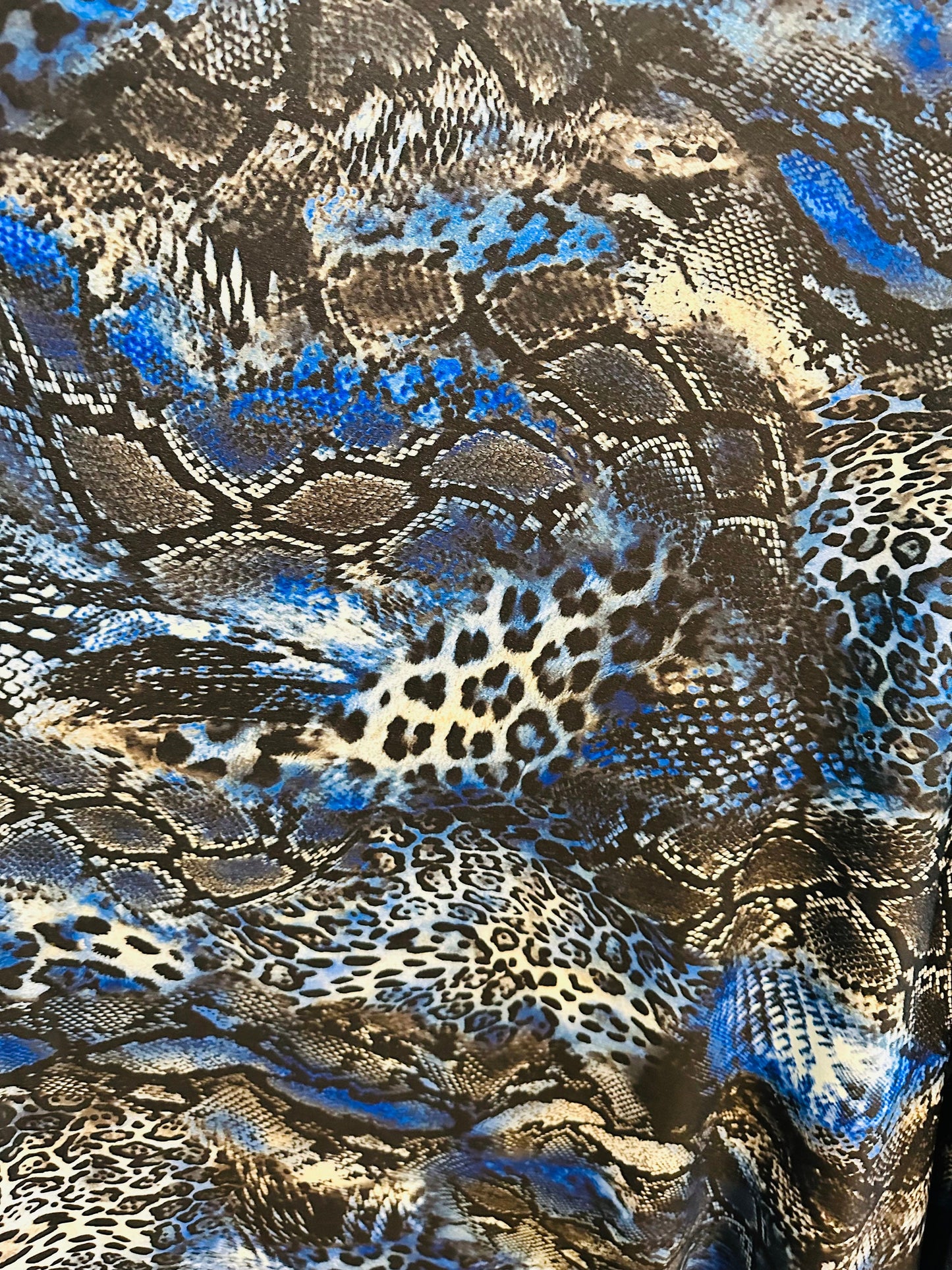 Spandex snake design exotic animal print on great quality of nylon spandex 4-way stretch 58/60” Sold by the YD.