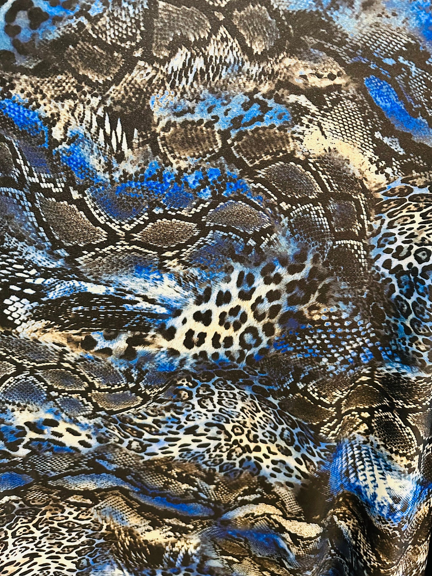 Spandex snake design exotic animal print on great quality of nylon spandex 4-way stretch 58/60” Sold by the YD.