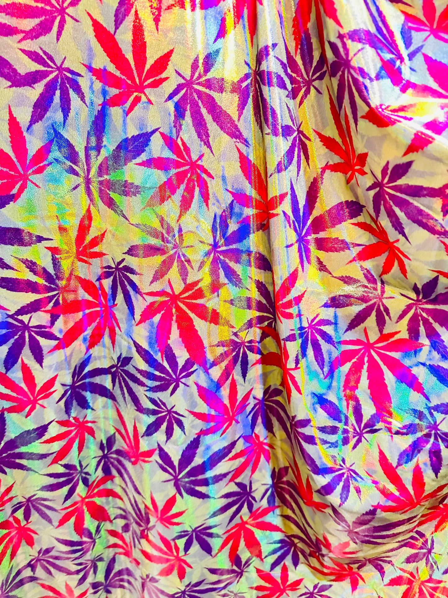 New Marijuana leaf design on Iridescent metallic nylon spandex with foggy foil 4-way stretch 58/60”
