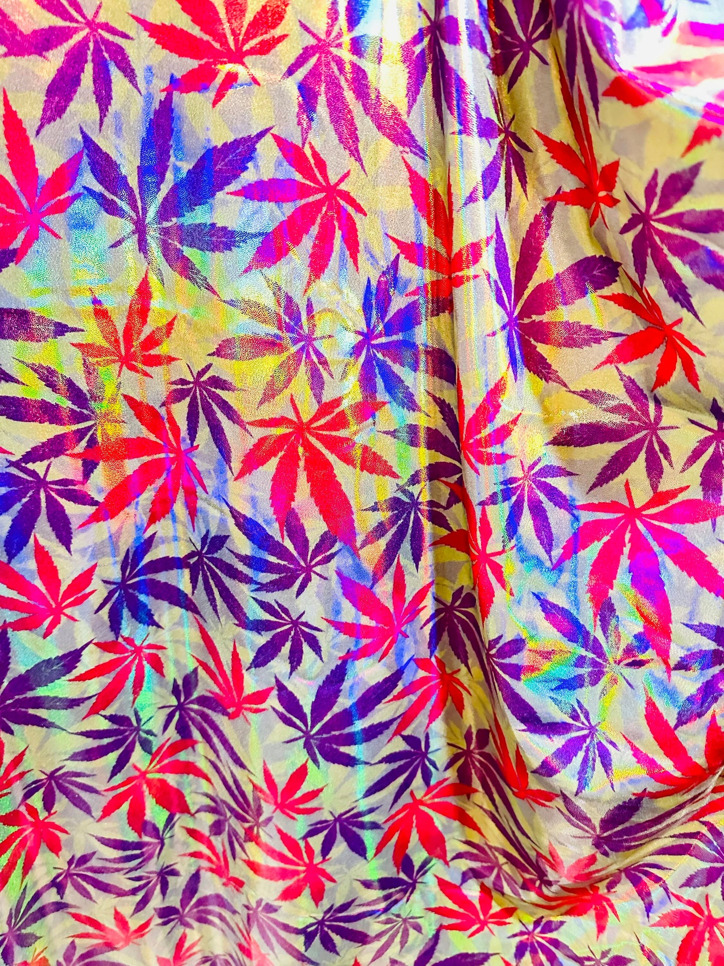 New Marijuana leaf design on Iridescent metallic nylon spandex with foggy foil 4-way stretch 58/60”