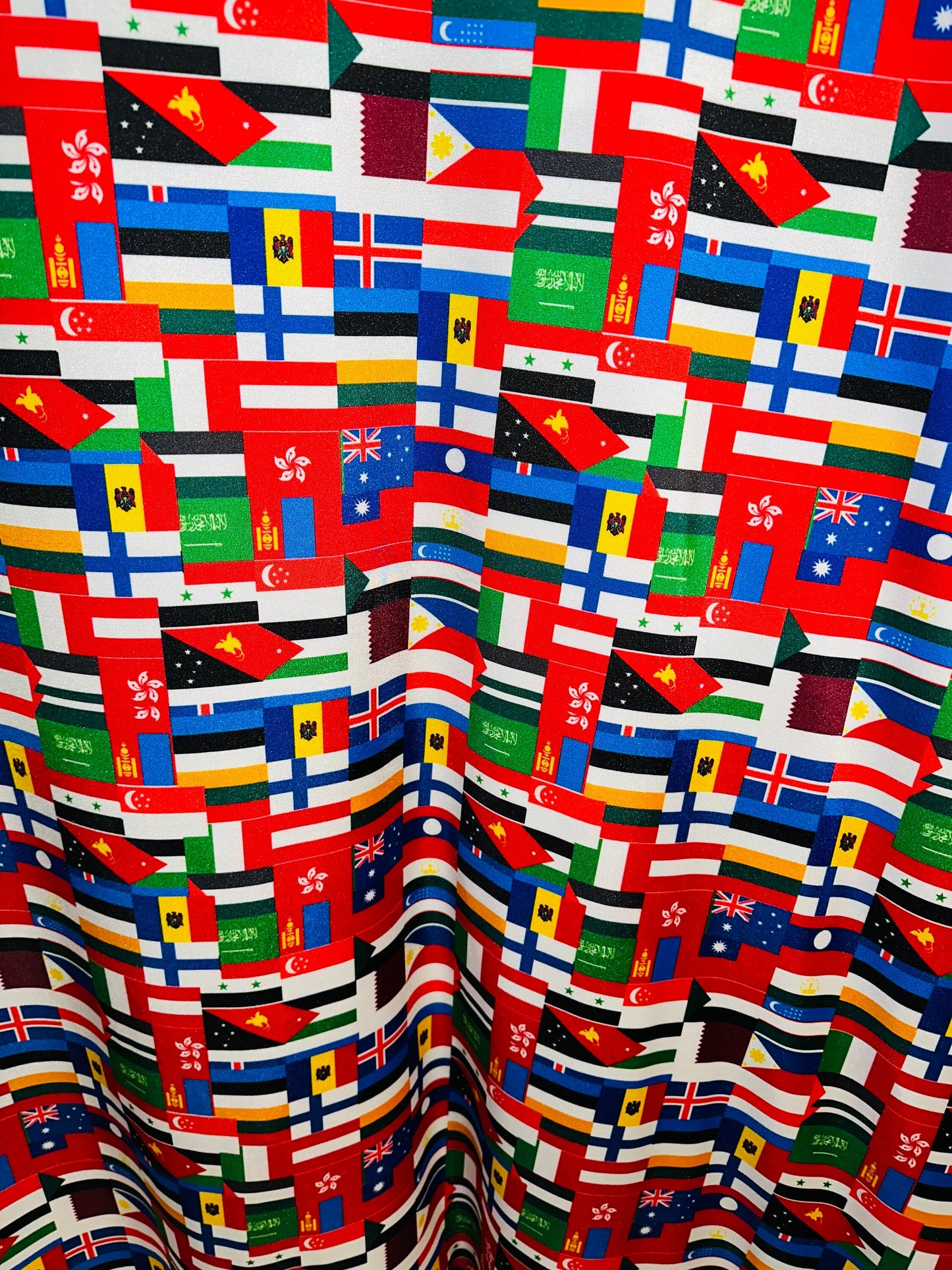 Nations flags design print on great quality of nylon spandex 4-way stretch 58/60” Sold by the YD.