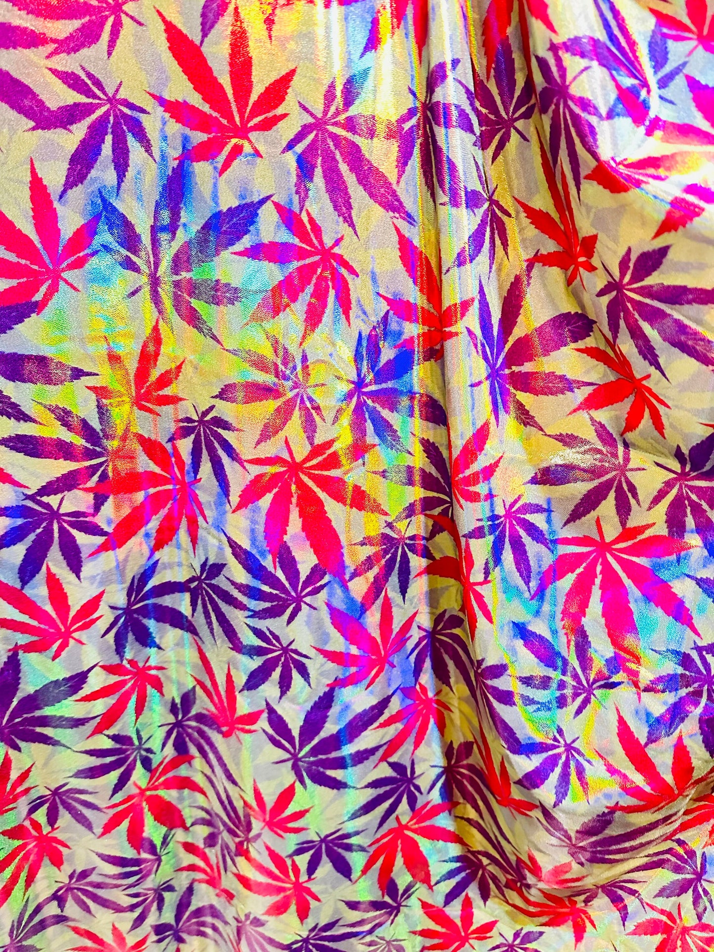 New Marijuana leaf design on Iridescent metallic nylon spandex with foggy foil 4-way stretch 58/60”