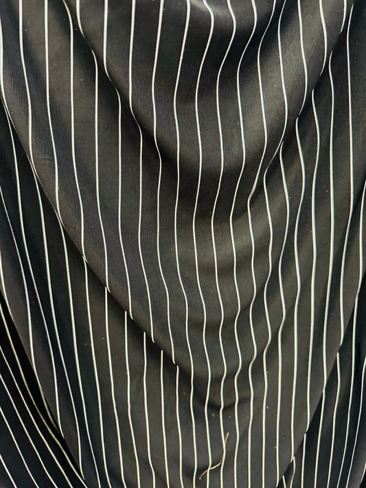 Pin stripes on nylon spandex 4-way stretch 58/60” Sold by the YD. Ships worldwide from Los Angeles California USA.