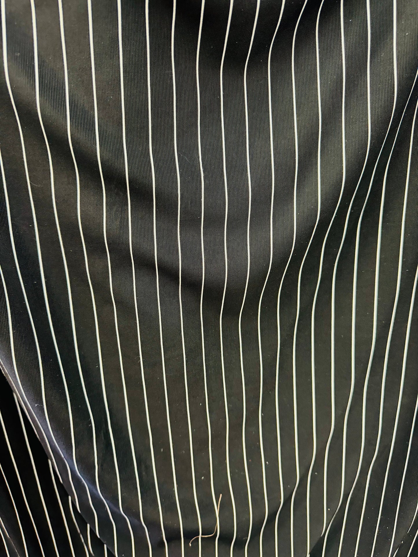 Pin stripes on nylon spandex 4-way stretch 58/60” Sold by the YD. Ships worldwide from Los Angeles California USA.
