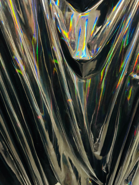 New lacer iridescent black vinyl 4-way stretch 58/60” Sold by the YD. Ships worldwide from Los Angeles California USA