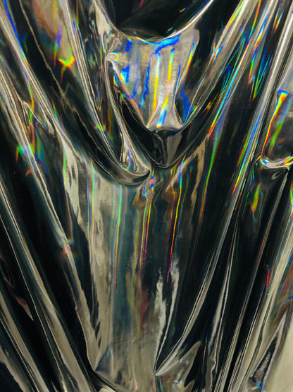 New lacer iridescent black vinyl 4-way stretch 58/60” Sold by the YD. Ships worldwide from Los Angeles California USA