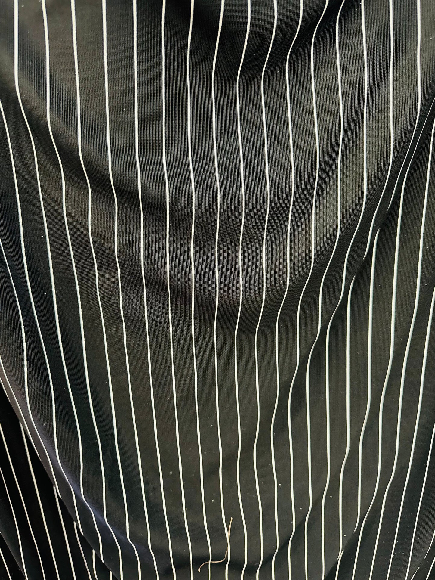 Pin stripes on nylon spandex 4-way stretch 58/60” Sold by the YD. Ships worldwide from Los Angeles California USA.