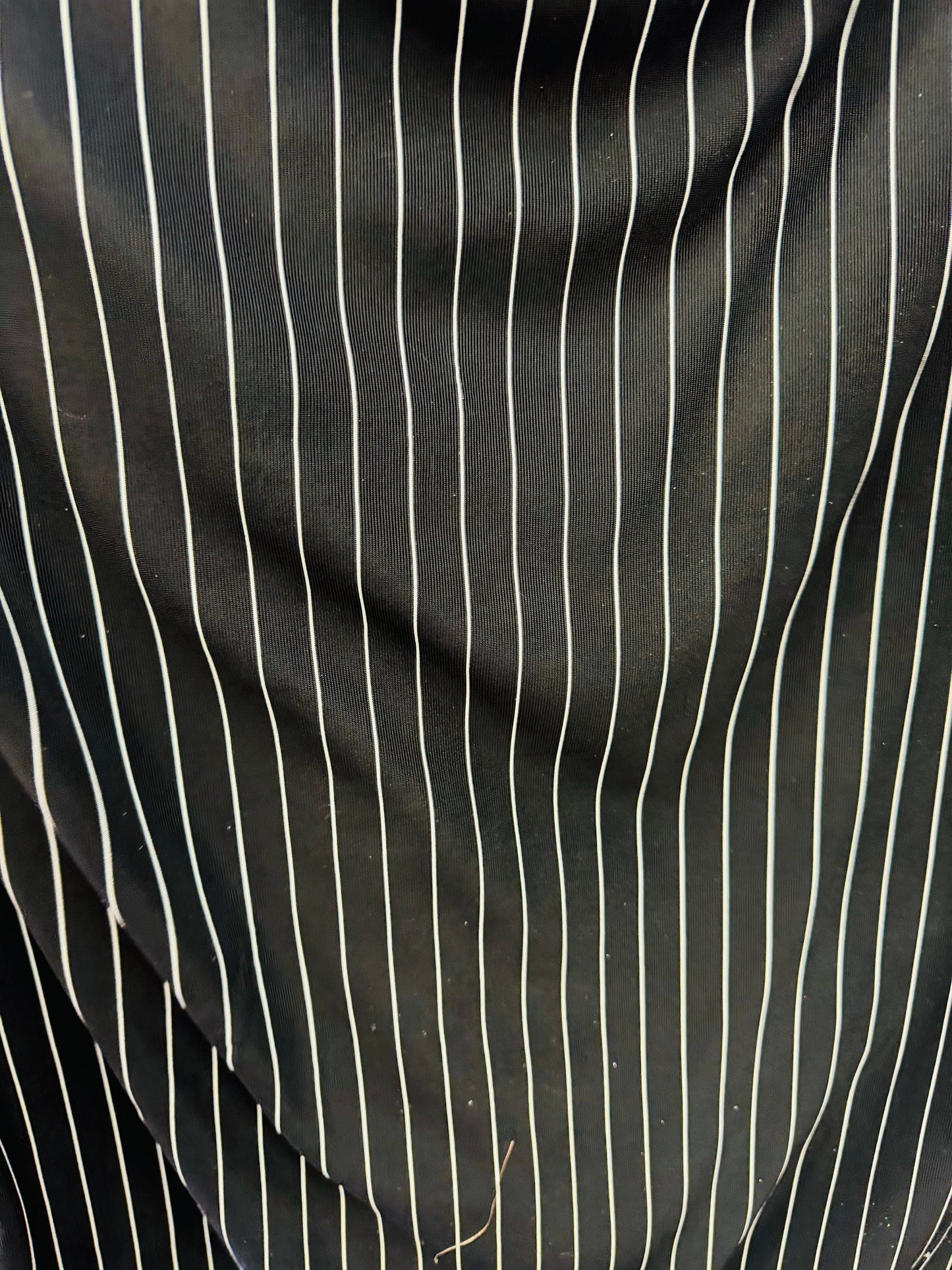 Pin stripes on nylon spandex 4-way stretch 58/60” Sold by the YD. Ships worldwide from Los Angeles California USA.