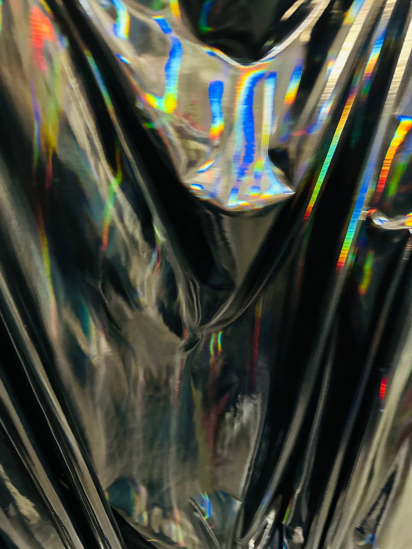 New lacer iridescent black vinyl 4-way stretch 58/60” Sold by the YD. Ships worldwide from Los Angeles California USA