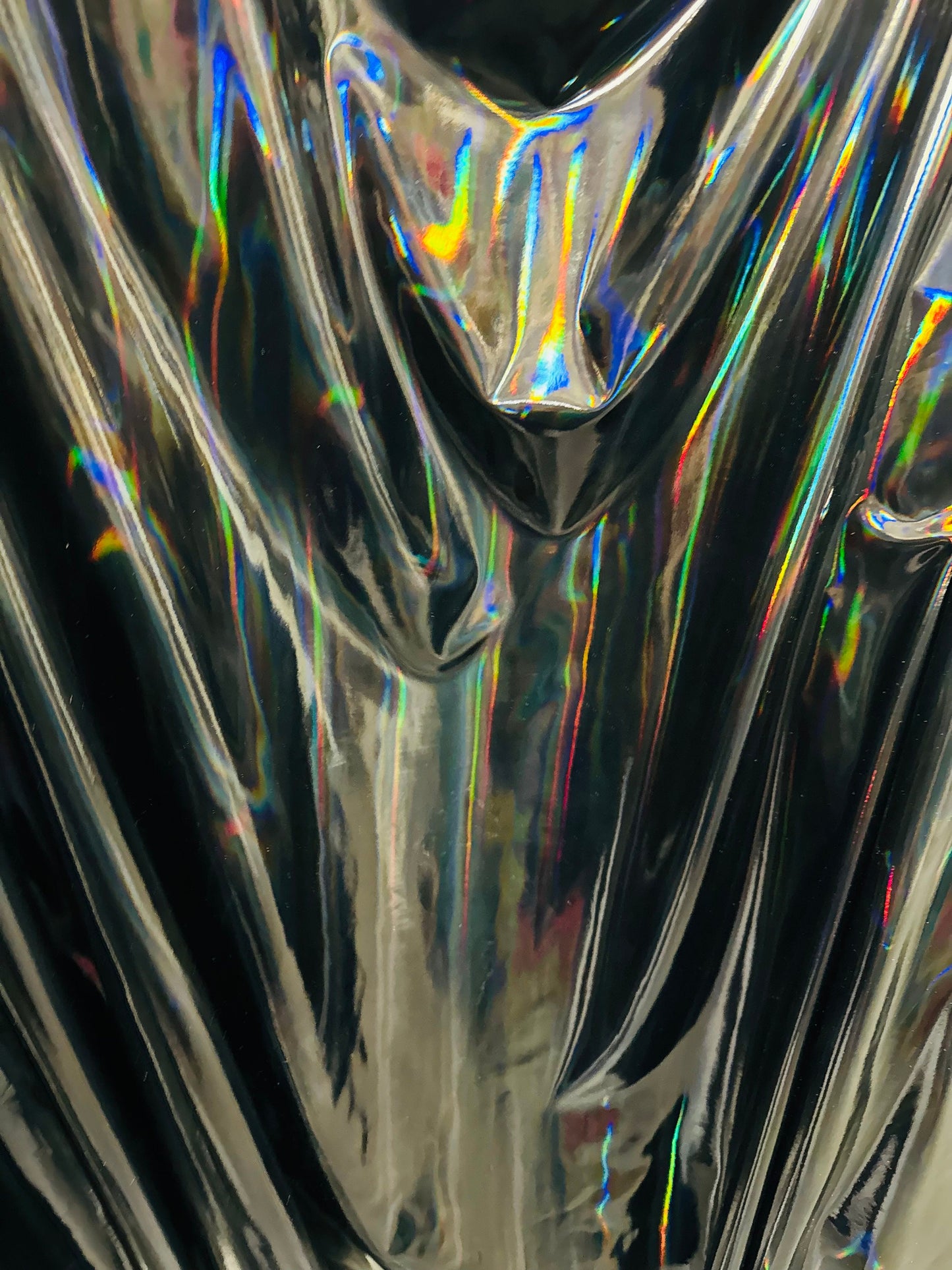 New lacer iridescent black vinyl 4-way stretch 58/60” Sold by the YD. Ships worldwide from Los Angeles California USA