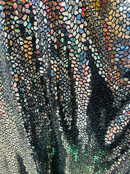 New Dragon and spectrum sequins on metallic spandex 4-way stretch 58/60” Sold by the YD. Ships Worldwide from Los Angeles California USA.