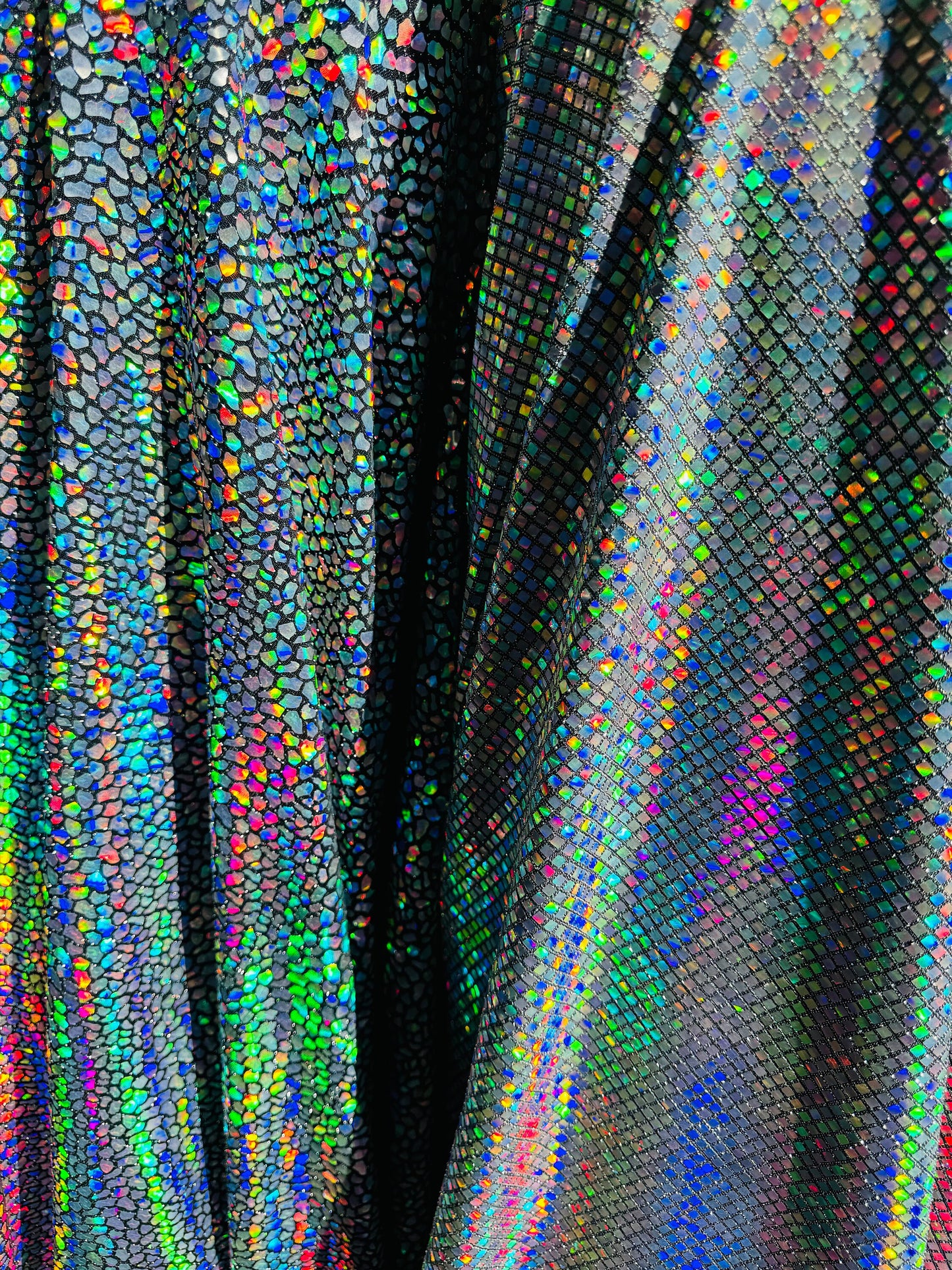 New Dragon and spectrum sequins on metallic spandex 4-way stretch 58/60” Sold by the YD. Ships Worldwide from Los Angeles California USA.