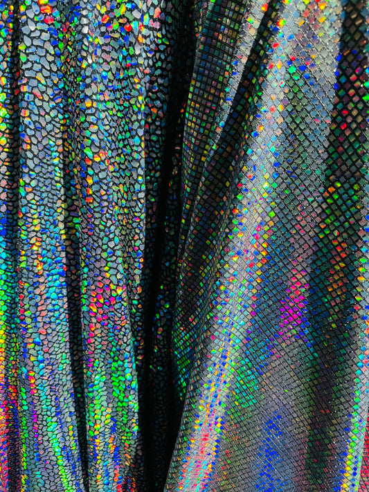New Dragon and spectrum sequins on metallic spandex 4-way stretch 58/60” Sold by the YD. Ships Worldwide from Los Angeles California USA.