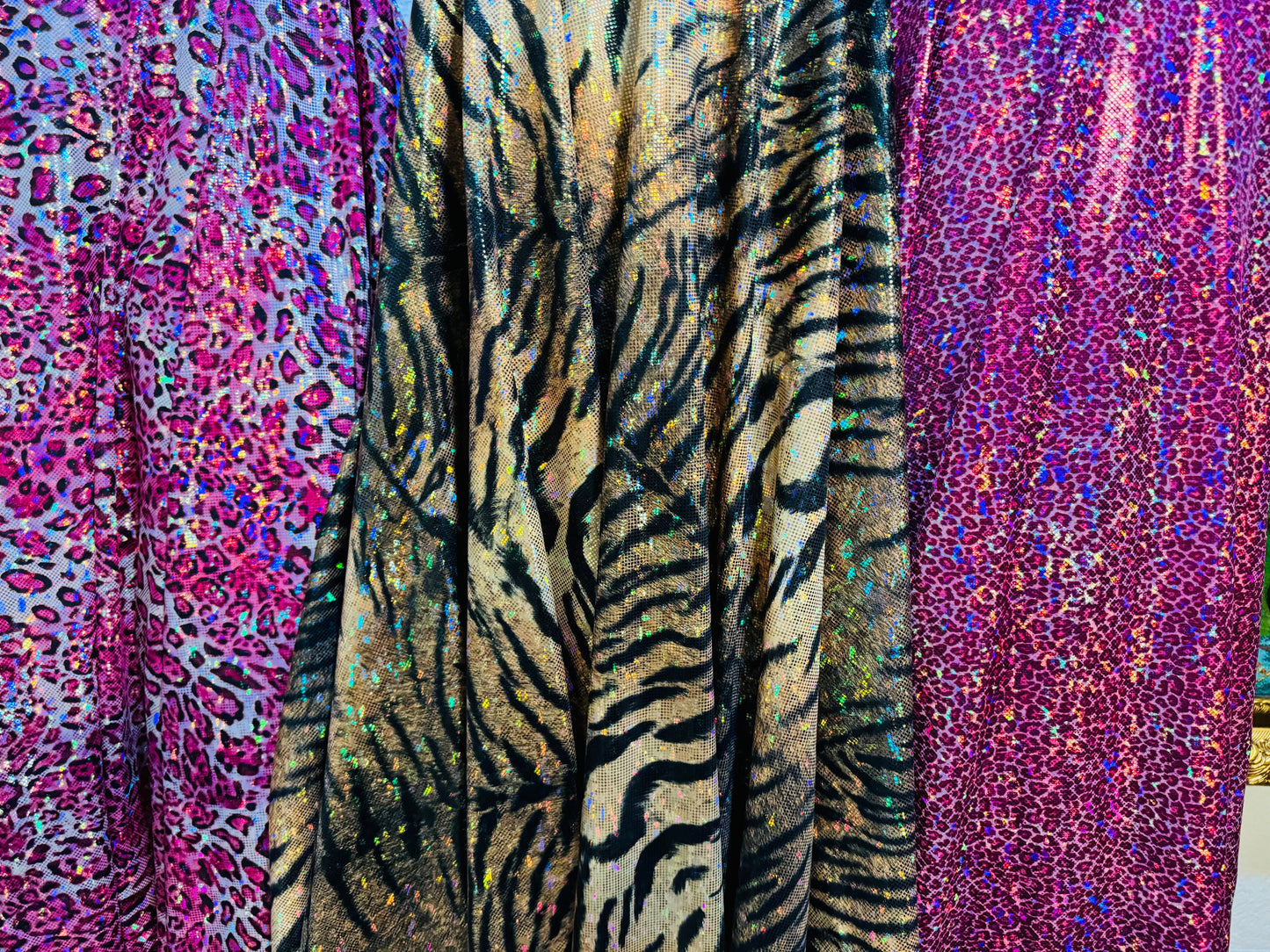 Exotic Multi Animal prints on hologram metallic shatter glass nylon spandex 4-way stretch 58/60” High quality fabrics by AlexLAFabrics