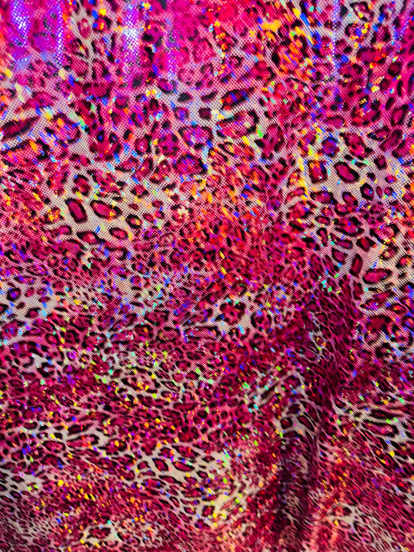 New Wild Leopard design on Hologram metallic nylon spandex 4-way stretch 58/60” Sold by the YD. Ships worldwide from Los Angeles CA