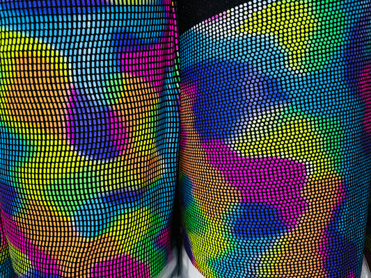Chameleon sequins design with neon colors it glows under black light metallic nylon spandex 2-way stretch 58/60”