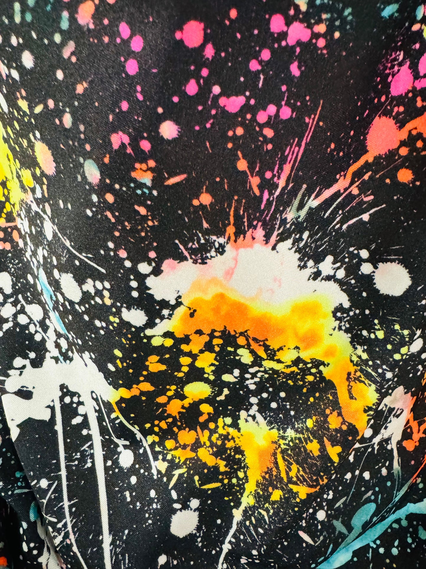 Luxury splatter paint design Black/Multicolor print on nylon spandex 4-way stretch 58/60” Sold by the YD. Ships worldwide