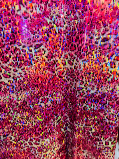 New Wild Leopard design on Hologram metallic nylon spandex 4-way stretch 58/60” Sold by the YD. Ships worldwide from Los Angeles CA
