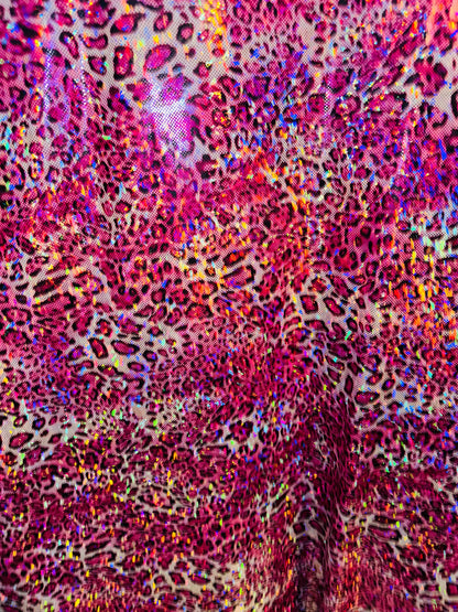 New Wild Leopard design on Hologram metallic nylon spandex 4-way stretch 58/60” Sold by the YD. Ships worldwide from Los Angeles CA
