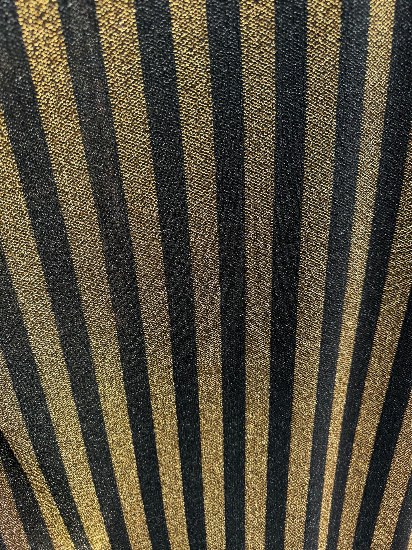 New metallic stripes design black/gold 2-way stretch 58/60” Sold by the YD.