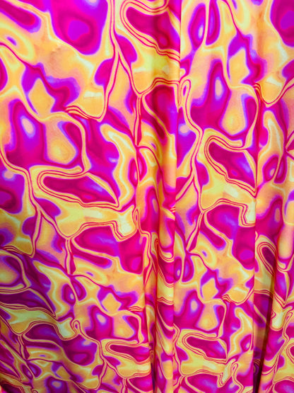 New Lava design Magenta yellow print on great quality of poly spandex 4-way stretch 58/60”