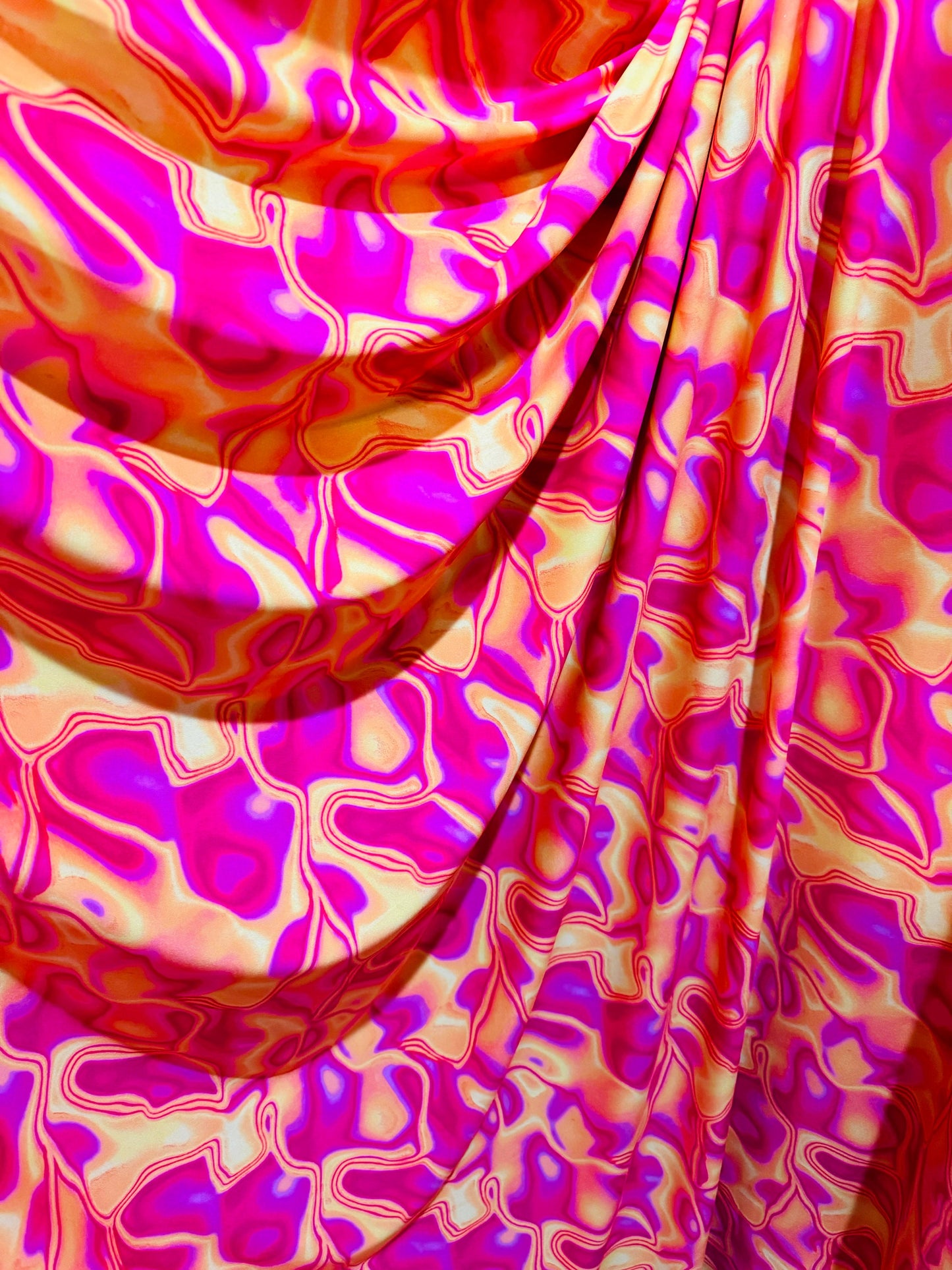 New Lava design Magenta yellow print on great quality of poly spandex 4-way stretch 58/60”
