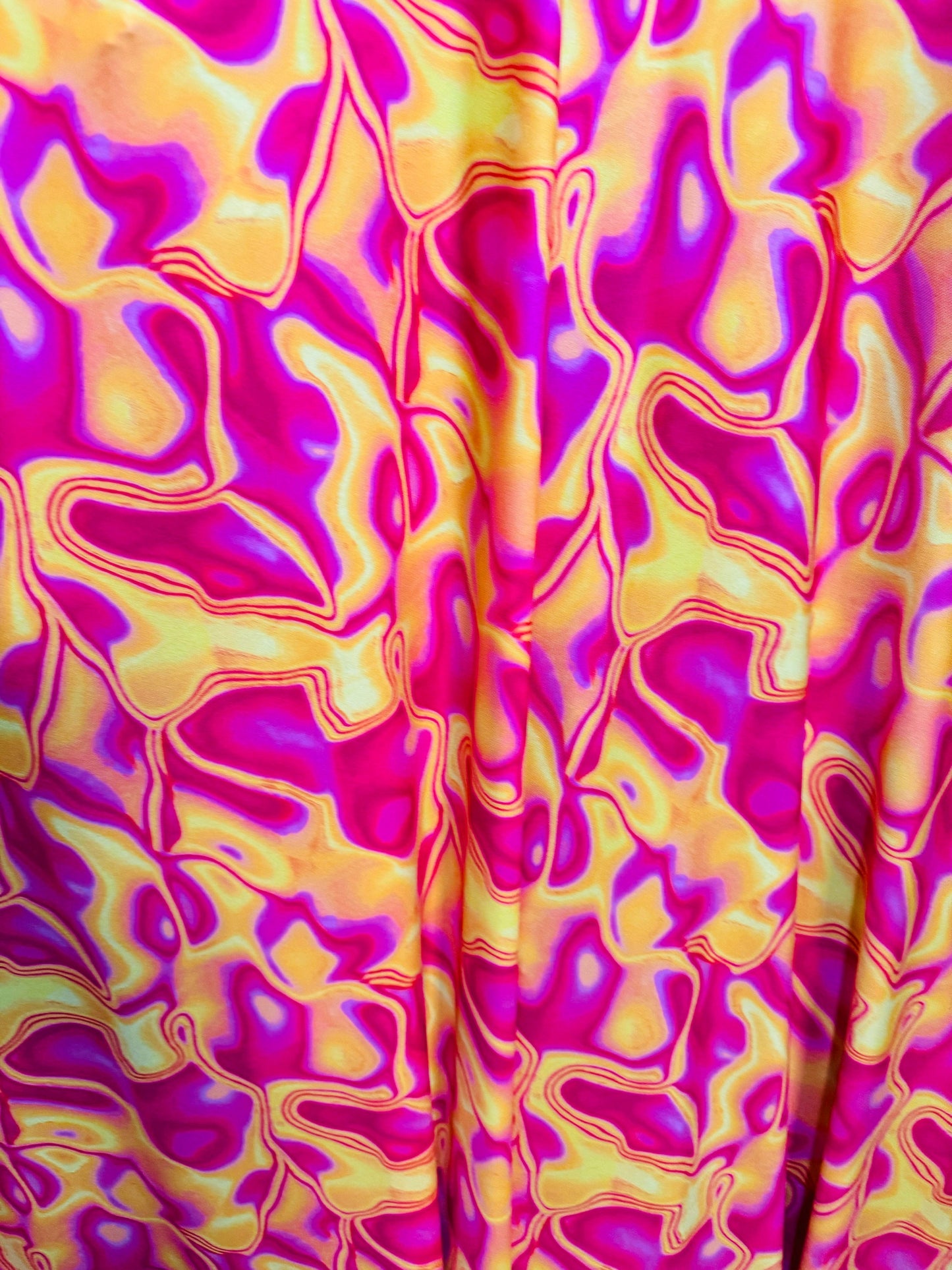 New Lava design Magenta yellow print on great quality of poly spandex 4-way stretch 58/60”